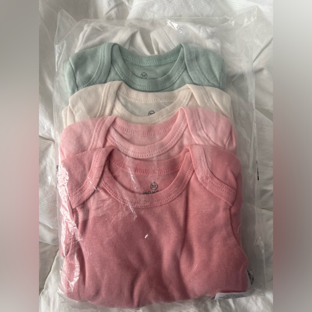 Honest 5 pack organic onesies  in 2 shades of Pink, Cream, White and Green